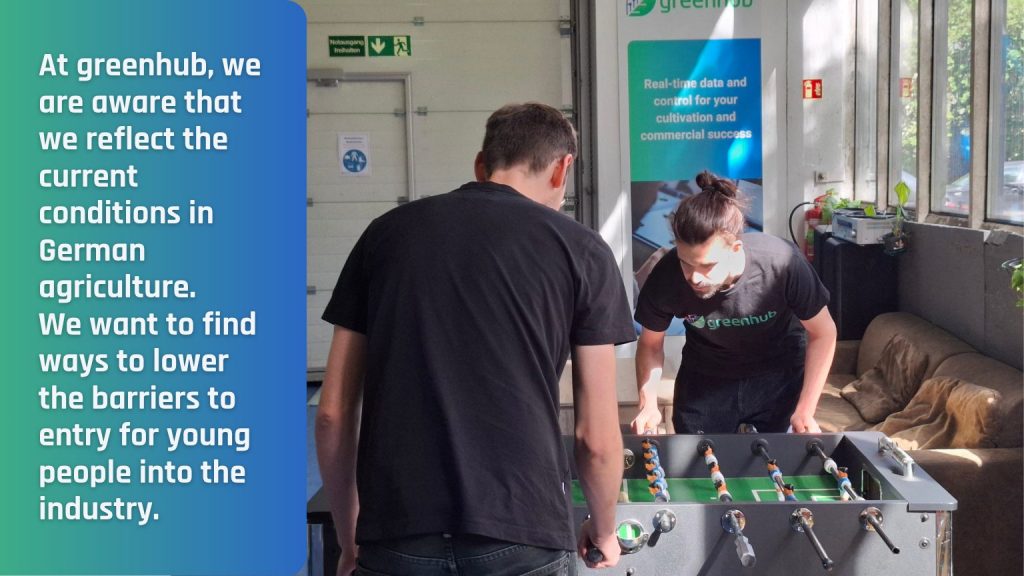 Picture of greenhub employees playing table football