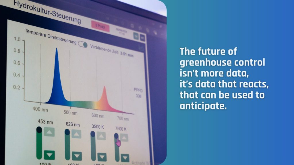 Grower controlling climate data in a modern greenhouse using smart technology.
